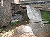 12. Dan uses a rock under his skid plate to jack the tire up..jpg