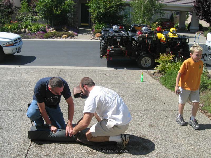 006. Terry and Dusty roll up my stuff for me...Mow my lawn next..jpg