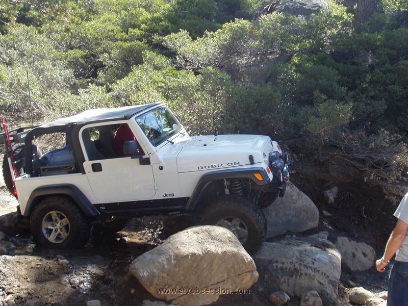 123. The Rubicon goes over the two boulders..jpg