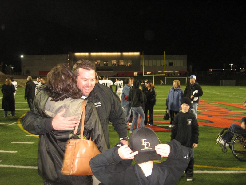 29. Lori gives Coach Bailey a big hug..jpg