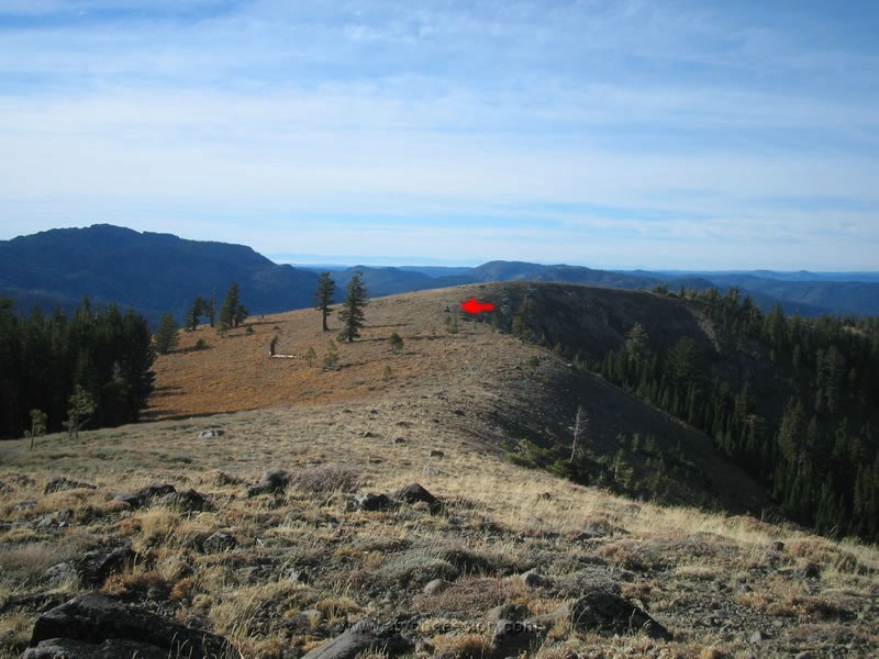 096. Joe works his way back to the rock formation..jpg