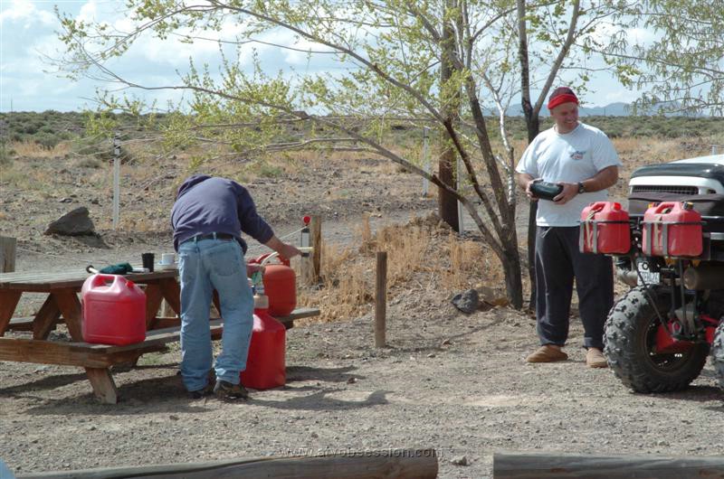 026. Larry Looks On As Mr. Bill Tops Off His 4 Extra Gas Cans, Can You Say EFI..jpg