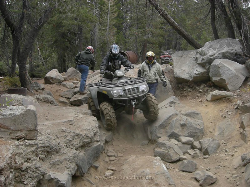 055. Wayne heads down a tricky section while Bill walks along side..jpg