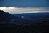 128. Way high over the highway, we see the town of Moab..jpg
